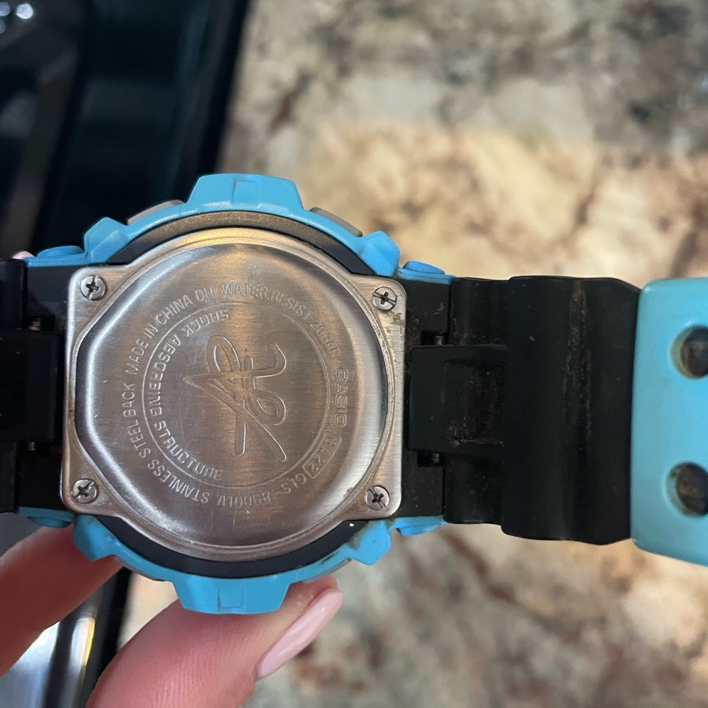G Shock black and light blue protection watch